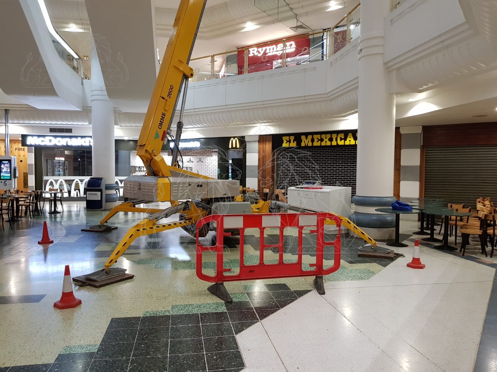 Commercial MEWP set up for high-level works inside a shopping centre