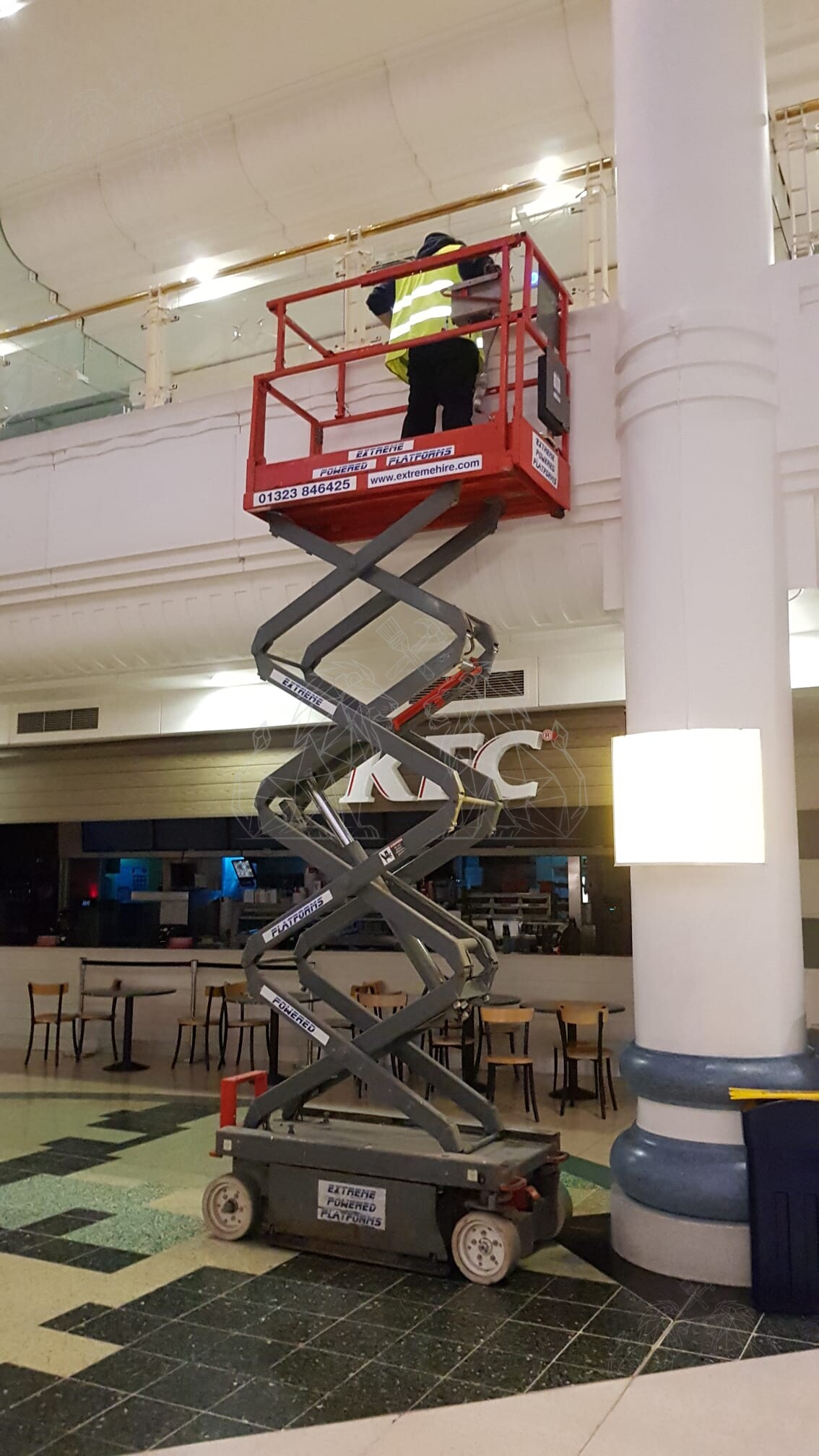 Scissor lift providing safe access to upper-level architectural details