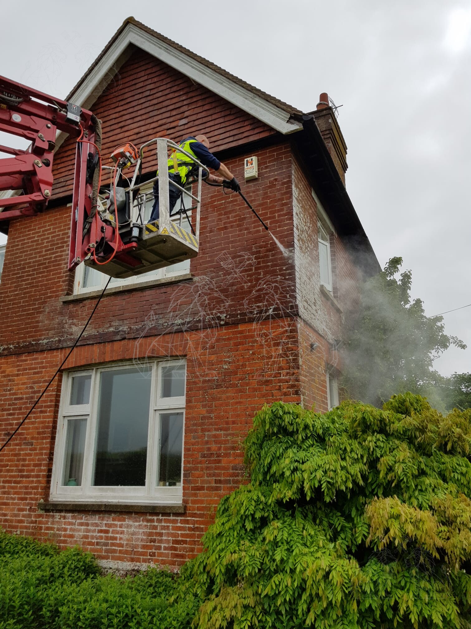 High-level pressure cleaning completed from a MEWP
