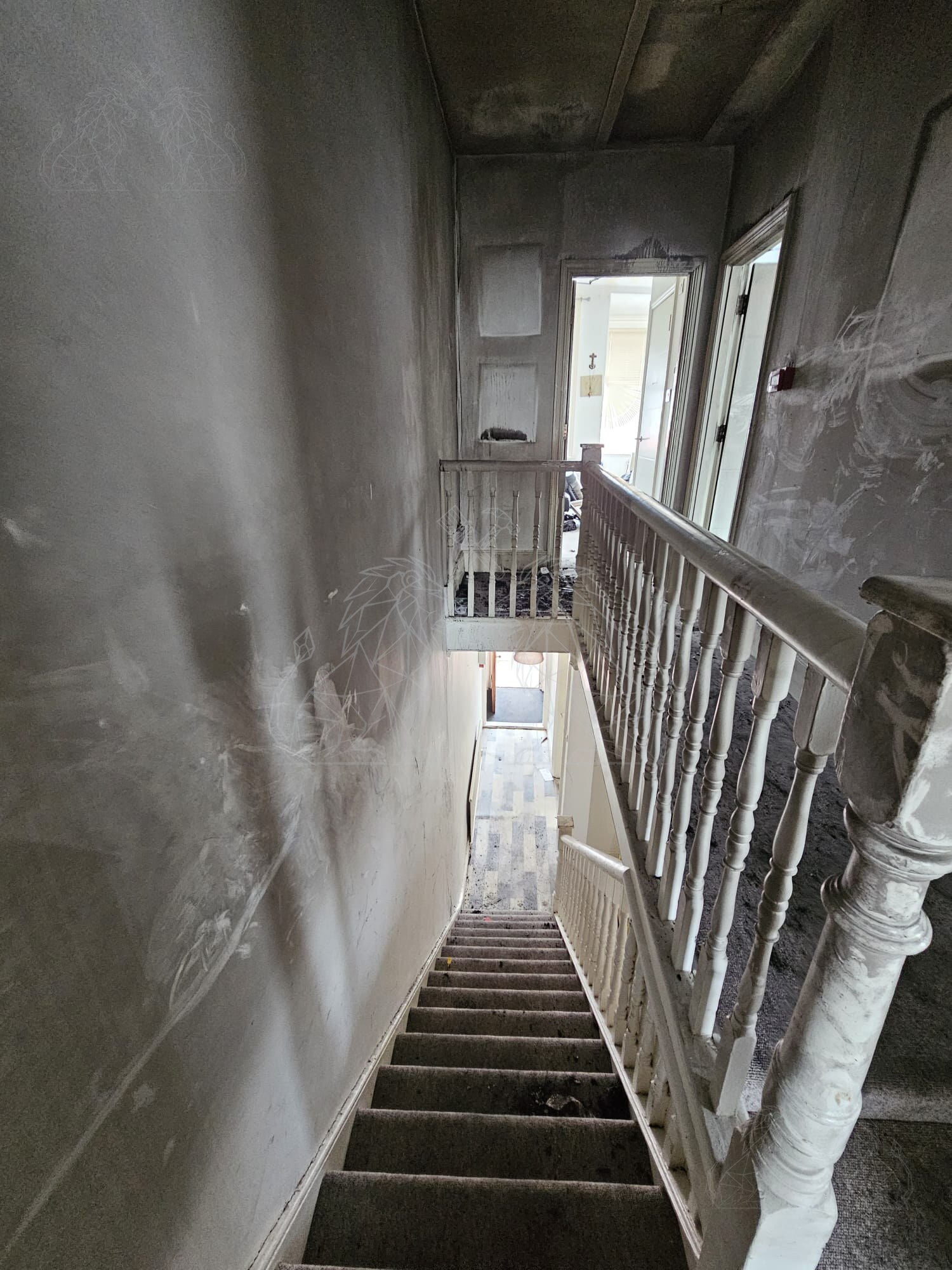 Fire and soot damage to hallway and stairwell
