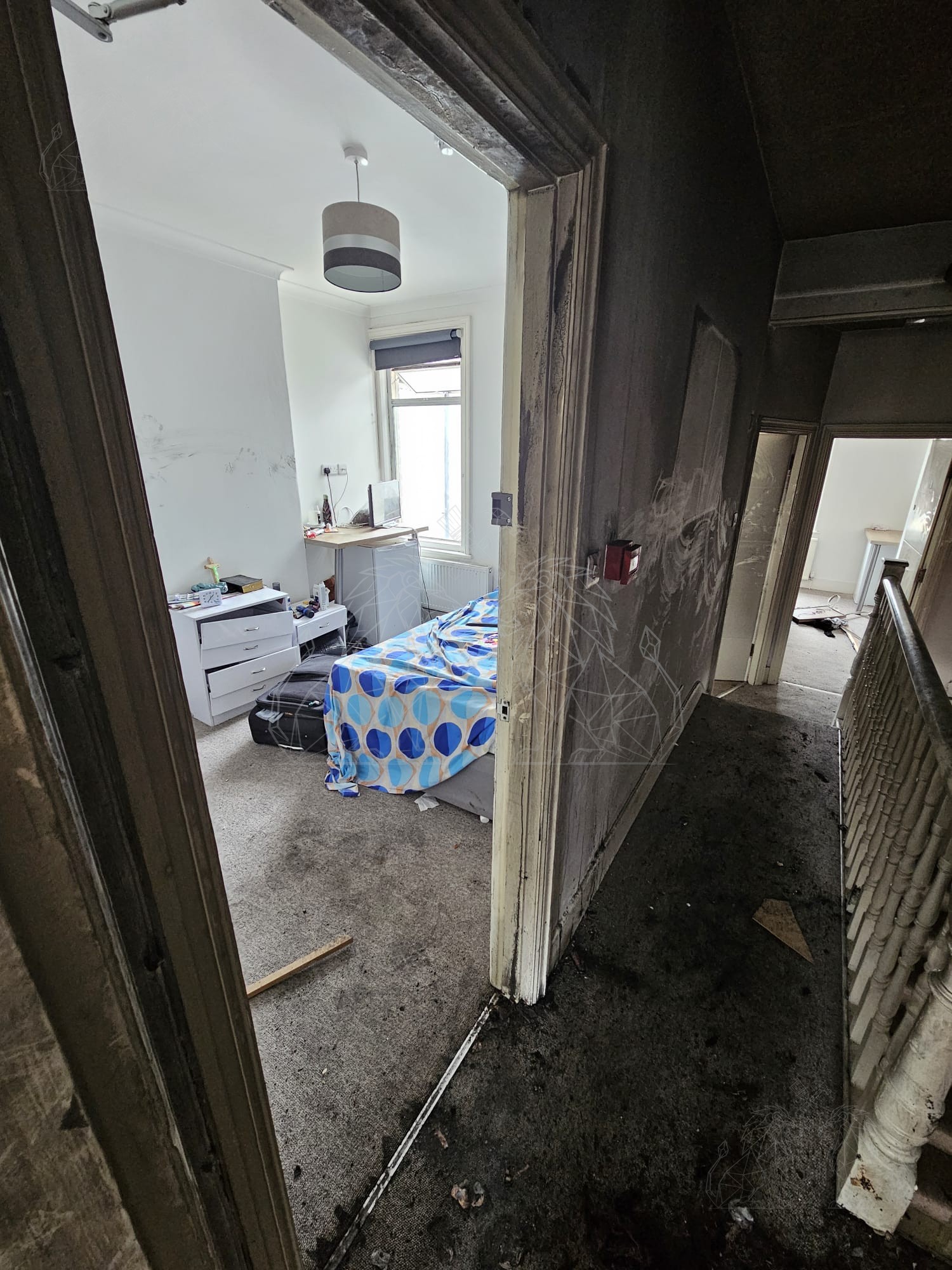 Fire damage across the upper hallway