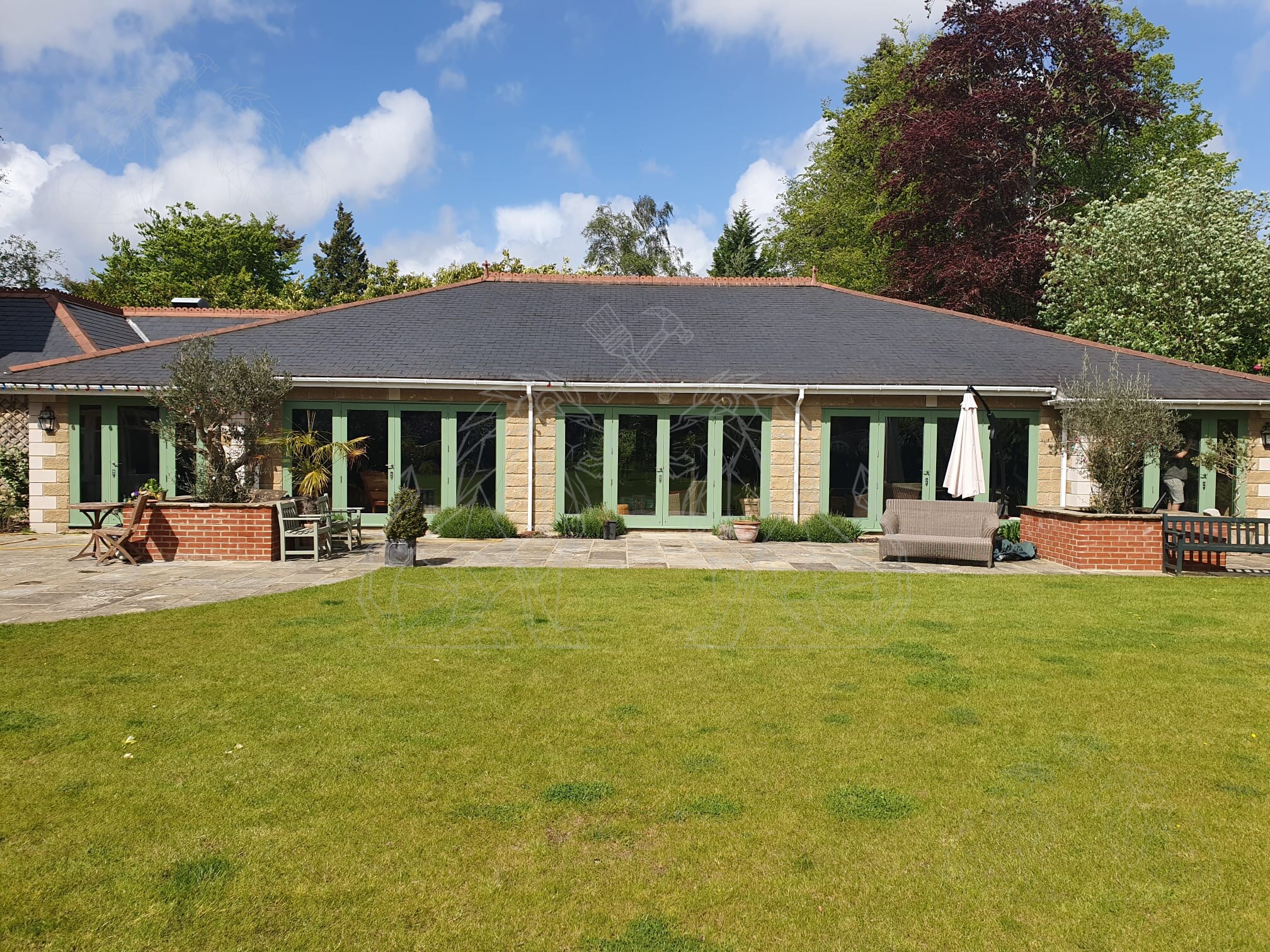 Large stone property and landscaped grounds