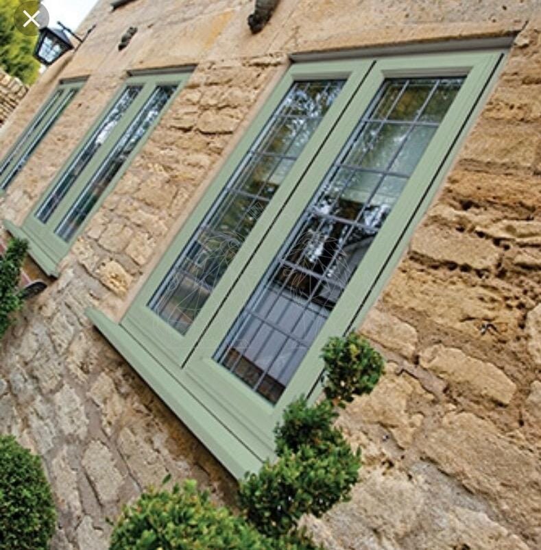 Restored sage-green doors and windows