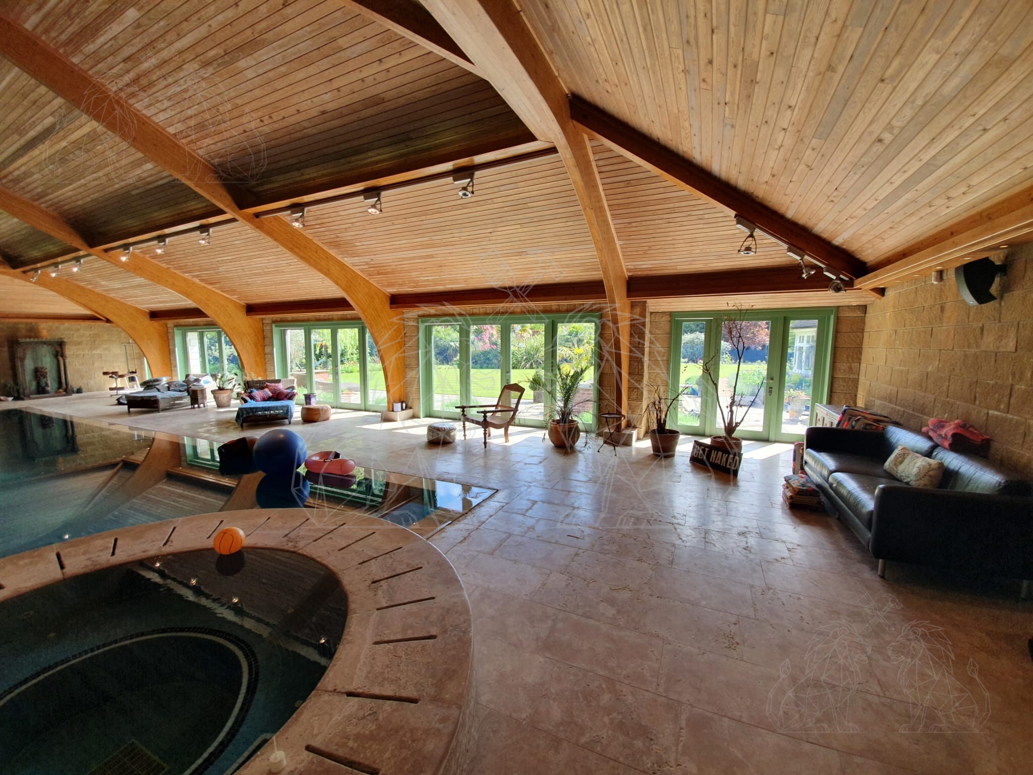 Pool house interior with timber ceiling