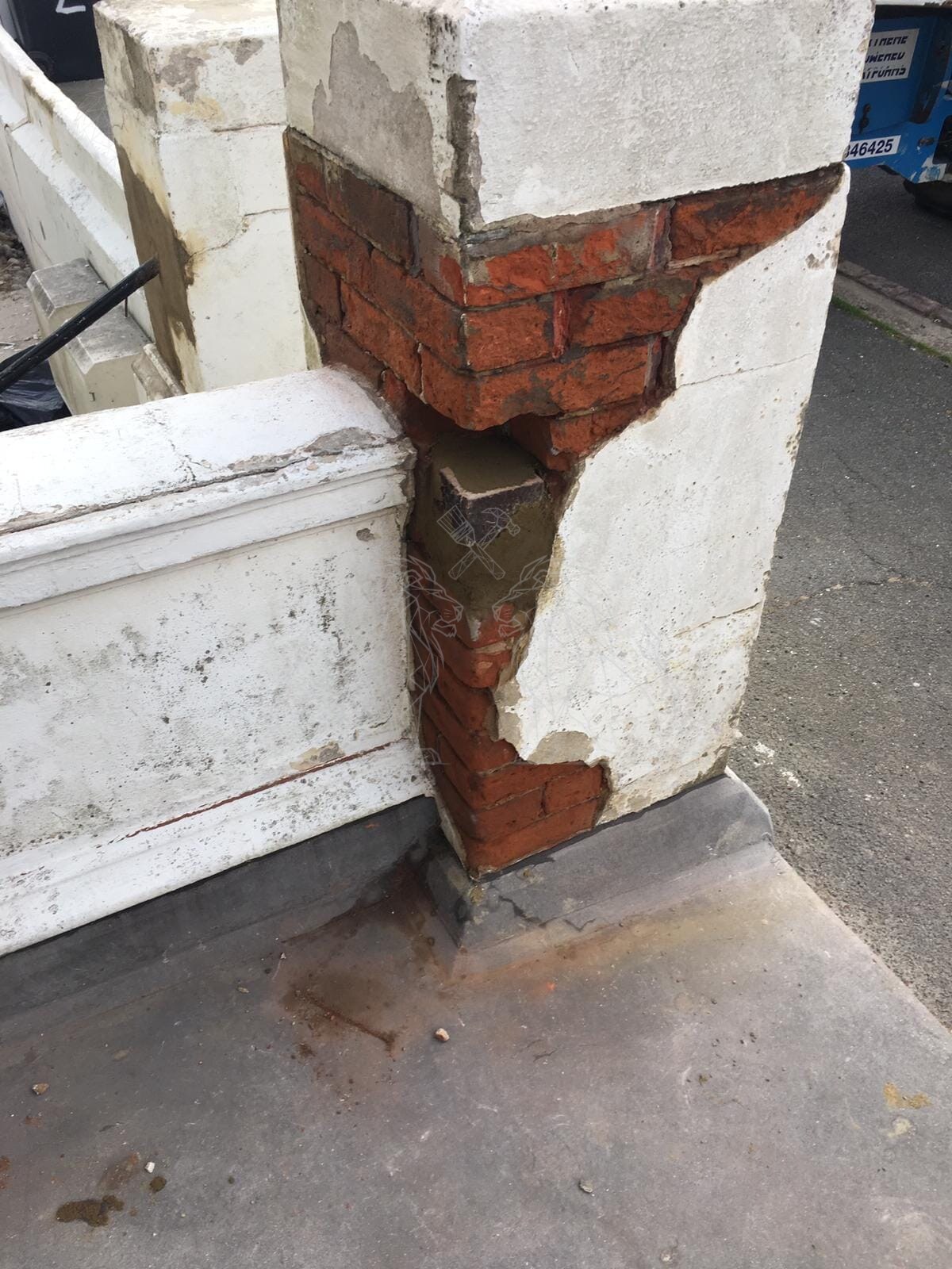 Masonry column repair in progress
